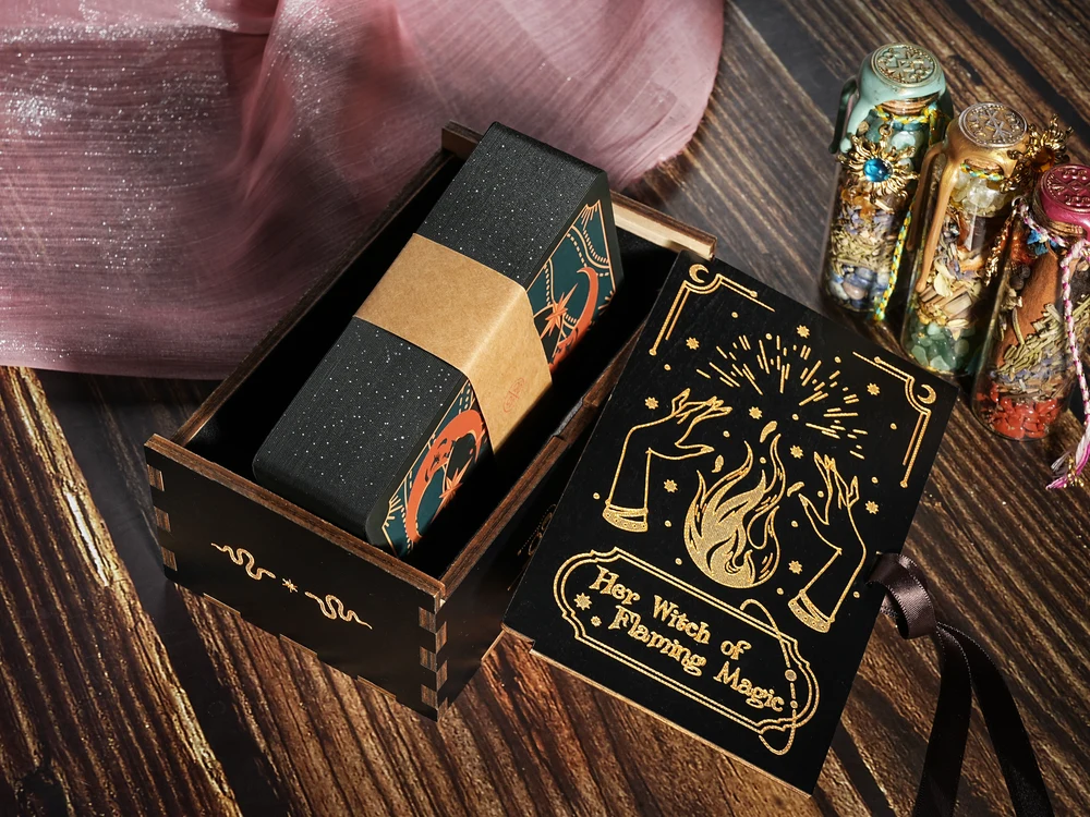 Deluxe hand-carved wooden tarot box holding a gold-edged deck